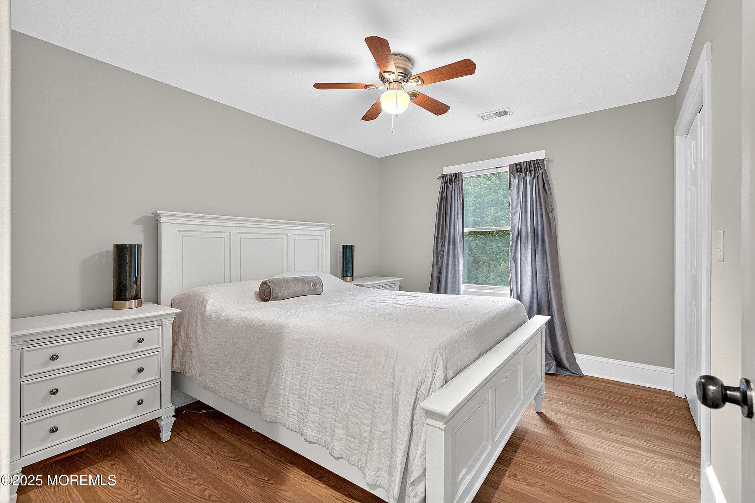 1961 Jumping Brook Road Tinton Falls, NJ 07753 - Photo 25 of 45 a bedroom with a bed and a window