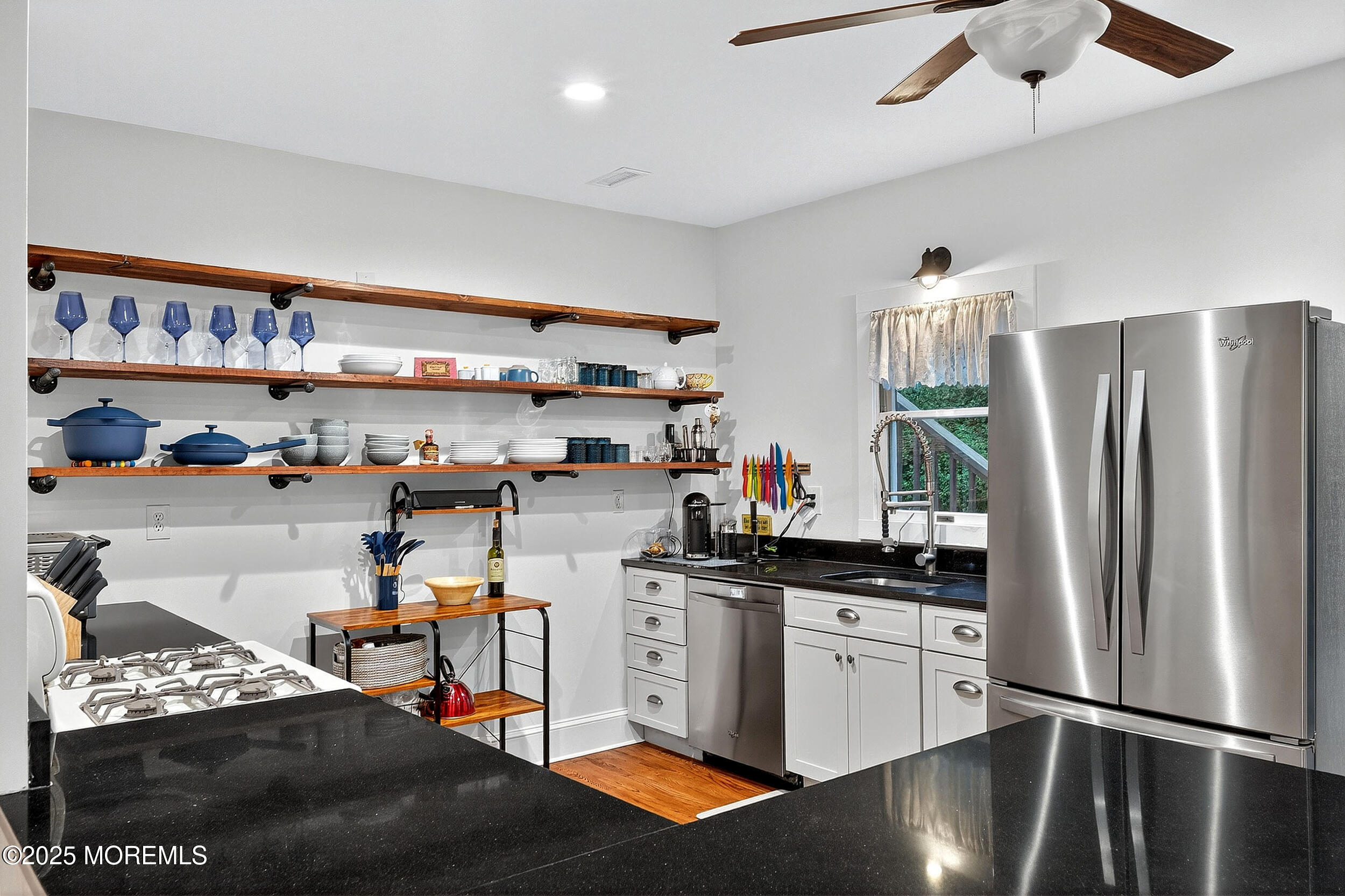 1961 Jumping Brook Road Tinton Falls, NJ 07753 - Photo 32 of 45 a kitchen with stainless steel appliances granite countertop a refrigerator and a stove