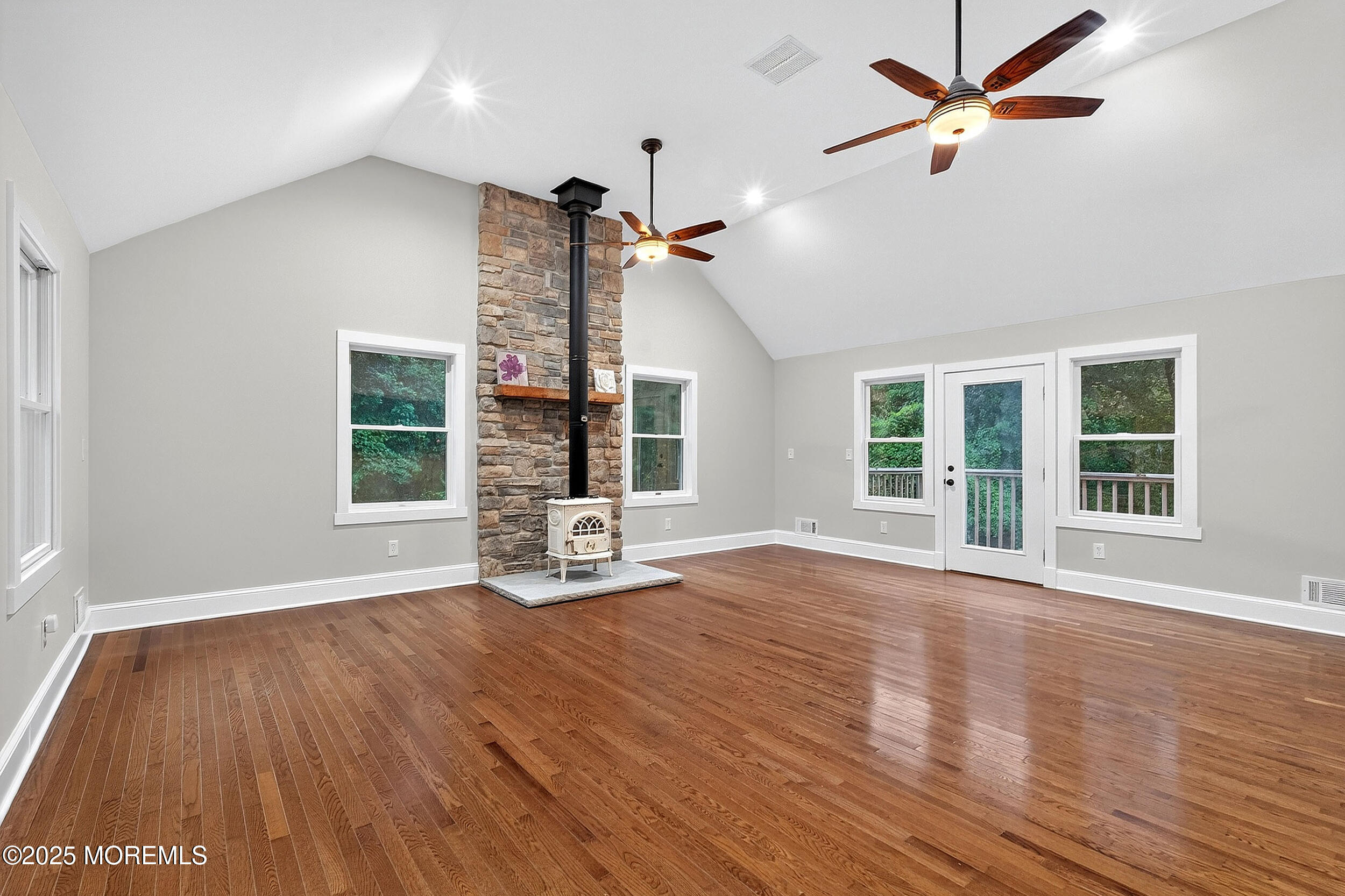 1961 Jumping Brook Road Tinton Falls, NJ 07753 - Photo 40 of 45 a view of a livingroom with wooden floor and a ceiling fan