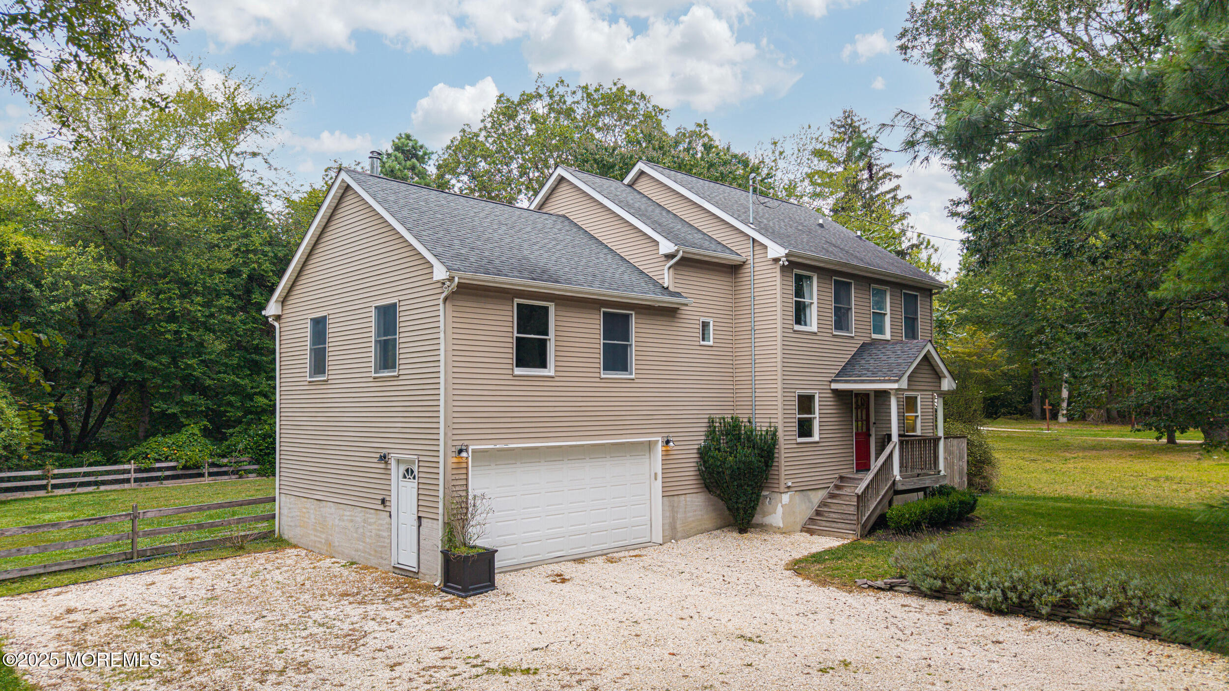 1961 Jumping Brook Road Tinton Falls, NJ 07753 - Photo 9 of 45 a view of a house with a yard and a garden