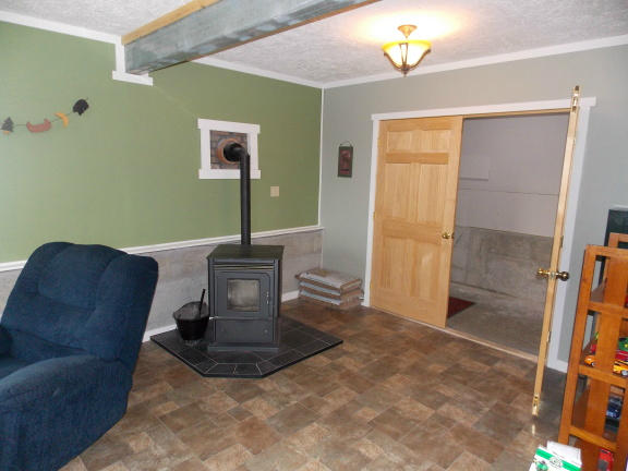 1340 Dusty Rock Road Northwest Riner, VA 24149 - Photo 22 of 35 a view of a livingroom with furniture and a flat screen tv