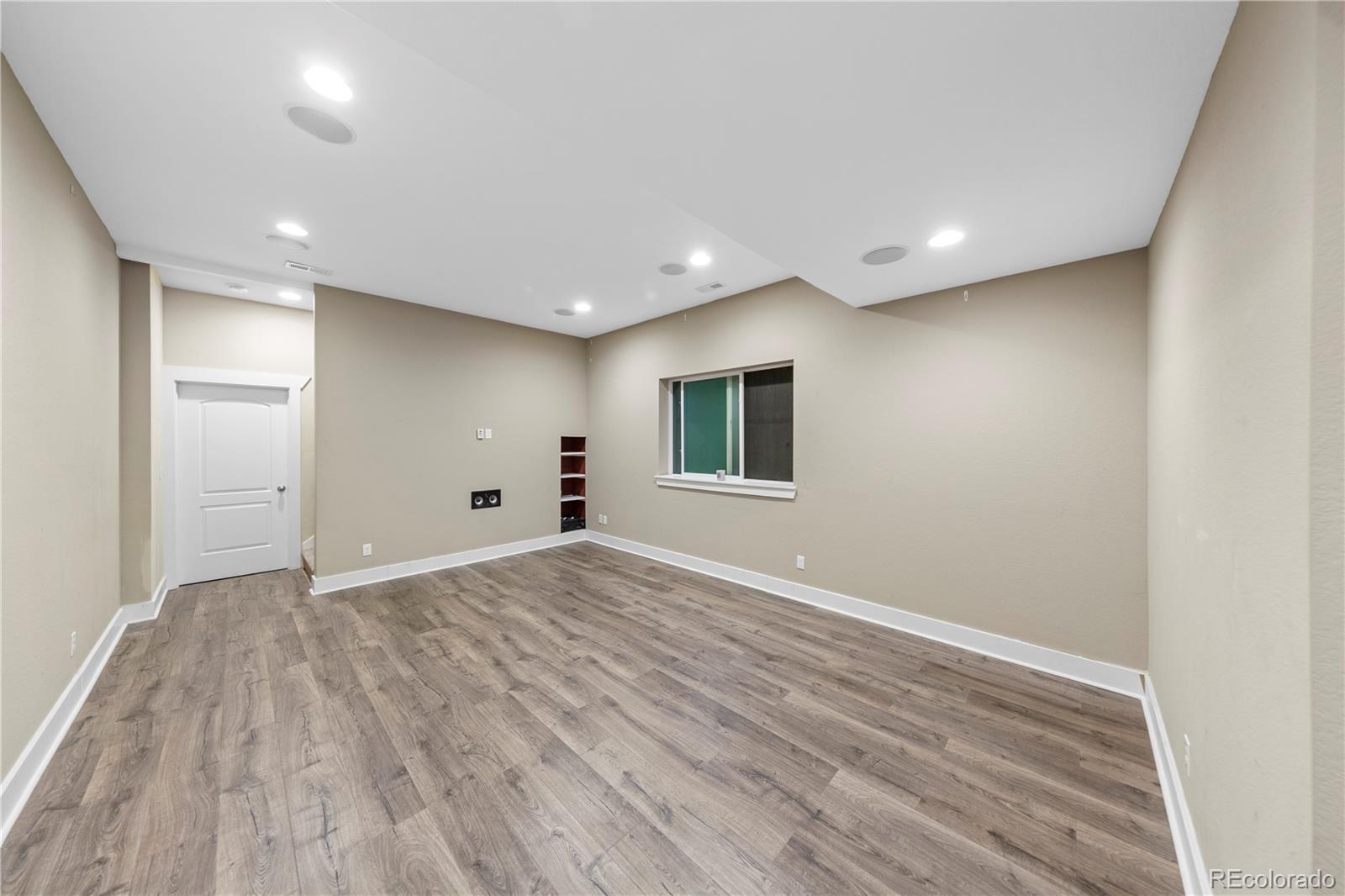 2907 Ironton Street Denver, CO 80238 - Photo 20 of 29 a view of empty room with wooden floor
