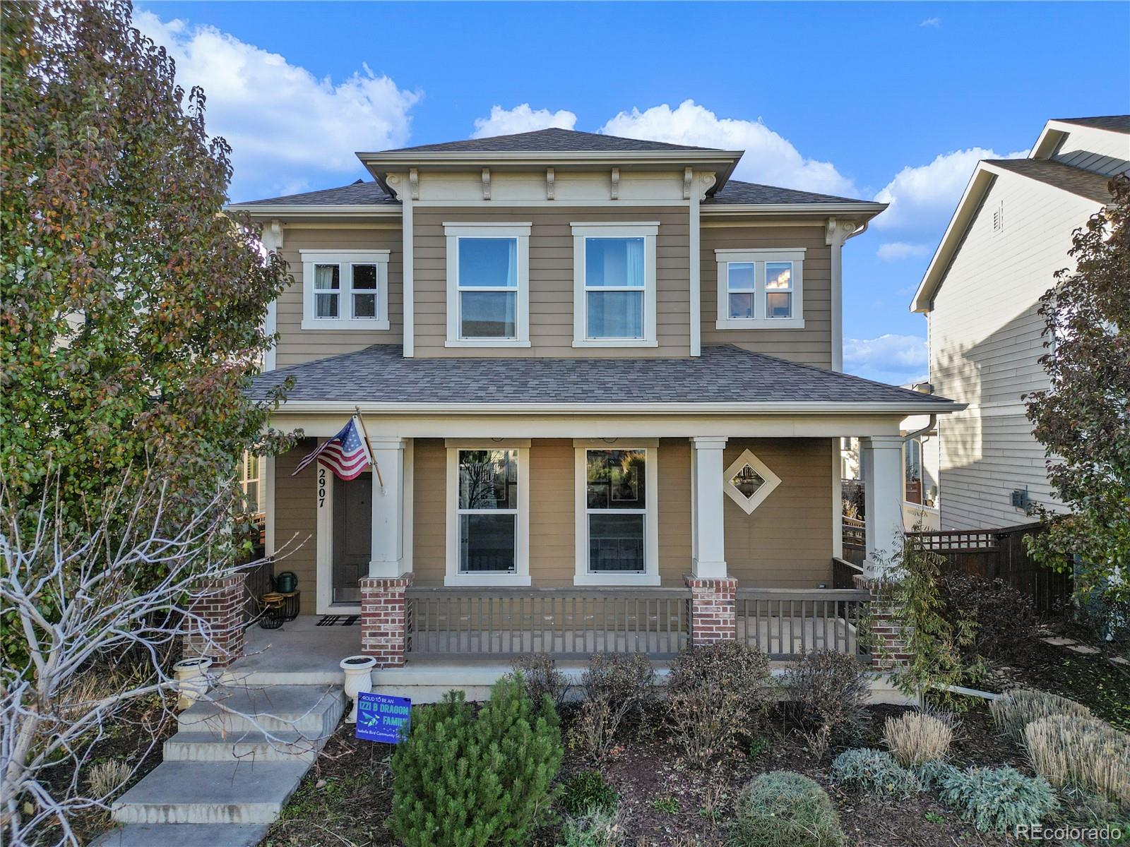 2907 Ironton Street Denver, CO 80238 - Photo 25 of 29 a front view of a house with a yard