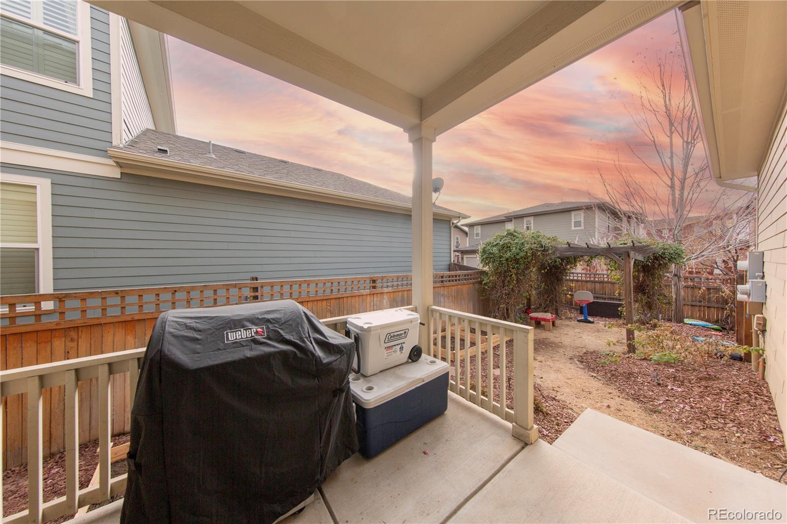 2907 Ironton Street Denver, CO 80238 - Photo 26 of 29 a view of a patio with a table and chairs