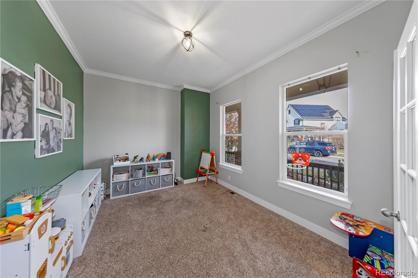 2907 Ironton Street Denver, CO 80238 - Photo 8 of 29 a bedroom with furniture and a chandelier