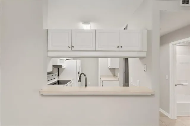 a kitchen with a sink and cabinets