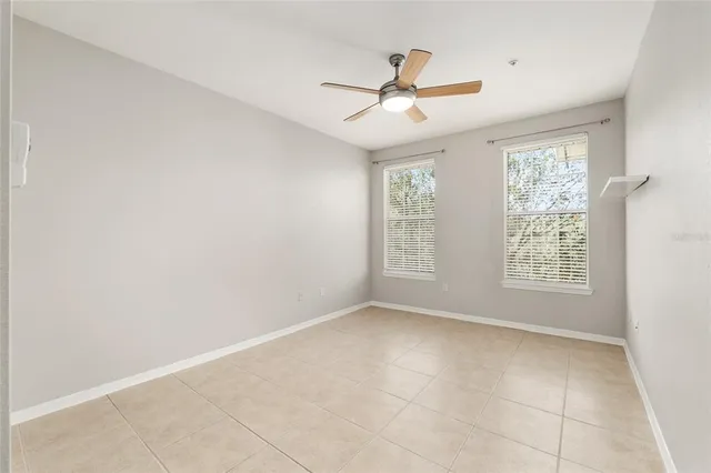 a view of room with window and ceiling fan