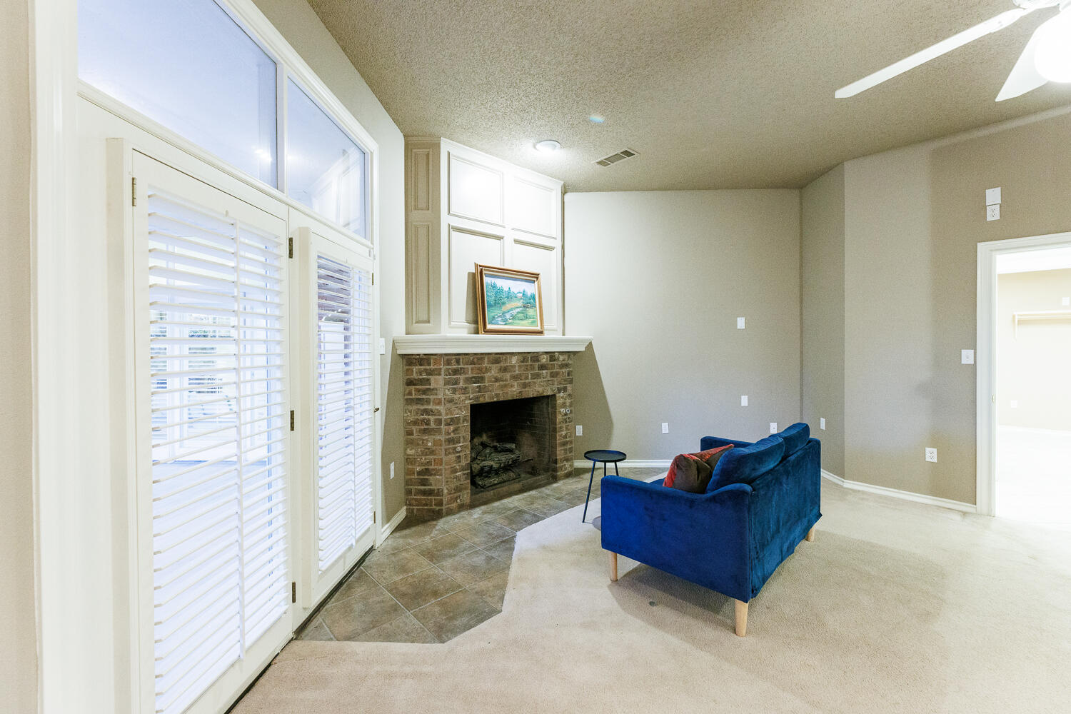 206 Collins Avenue Sundown, TX 79372 - Photo 29 of 82 a living room with furniture and a fireplace