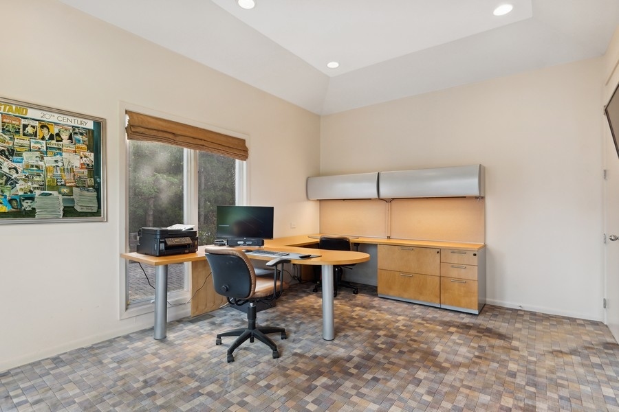 69 Riverside Drive Deerfield, IL 60015 - Photo 11 of 27 a view of a workspace with furniture and a window