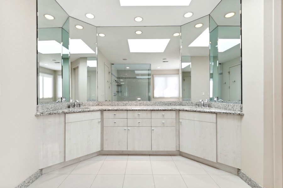 69 Riverside Drive Deerfield, IL 60015 - Photo 14 of 27 a bathroom with a sink double vanity and a mirror