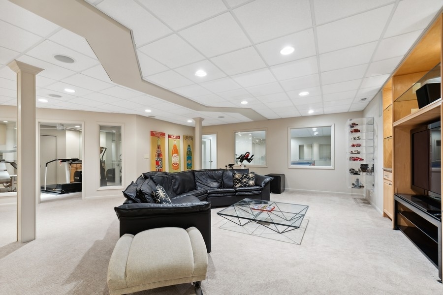69 Riverside Drive Deerfield, IL 60015 - Photo 19 of 27 a living room with furniture and a flat screen tv