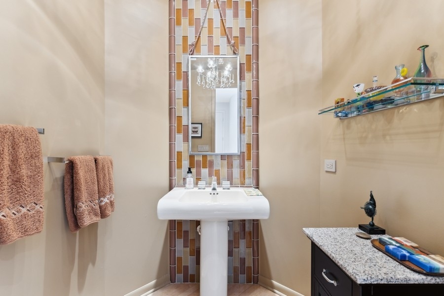 69 Riverside Drive Deerfield, IL 60015 - Photo 8 of 27 a bathroom with a sink and a mirror