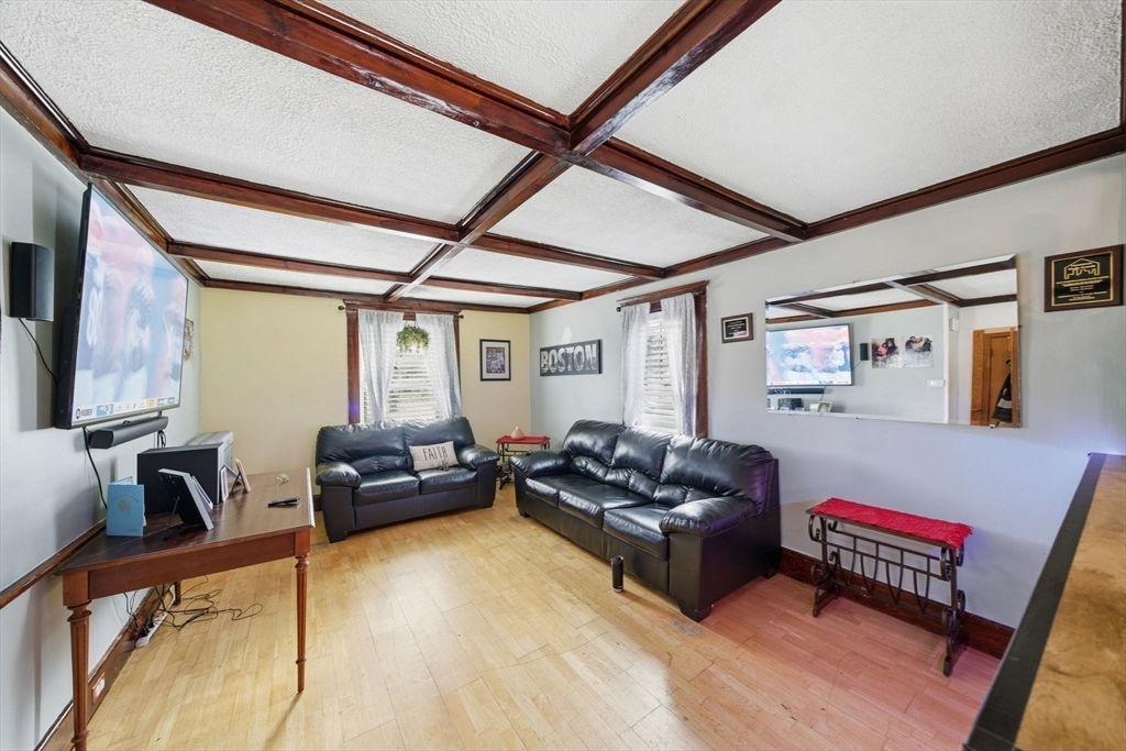 37 Albion Street Methuen, MA 01844 - Photo 13 of 26 a living room with furniture and a flat screen tv