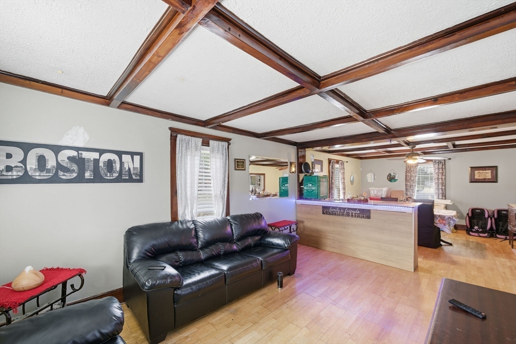 37 Albion Street Methuen, MA 01844 - Photo 14 of 26 a living room with furniture and a wooden floor