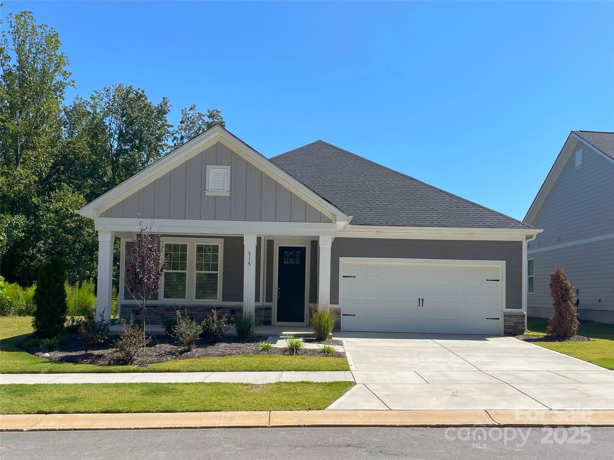 515 Tates Trail, Unit 39 Cramerton, NC 28056 - Photo 1 of 33 a front view of a house with a yard