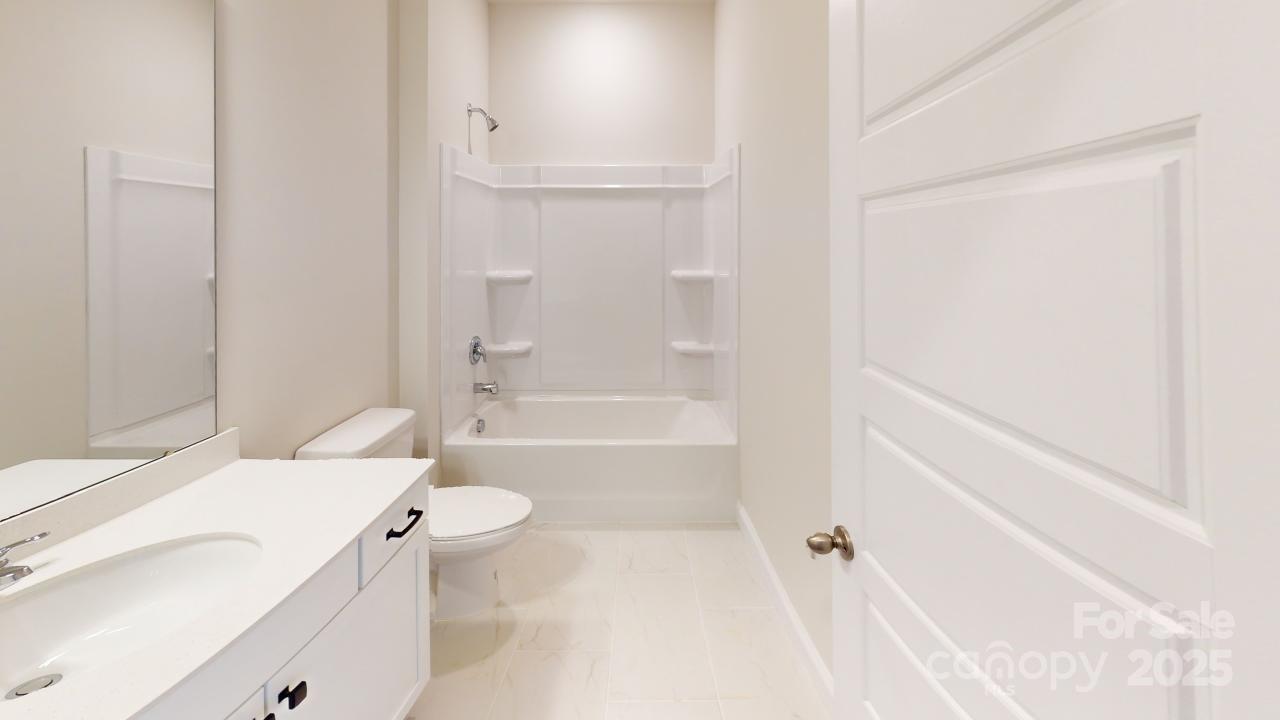 515 Tates Trail, Unit 39 Cramerton, NC 28056 - Photo 13 of 33 a bathroom with a sink a toilet and a bathtub