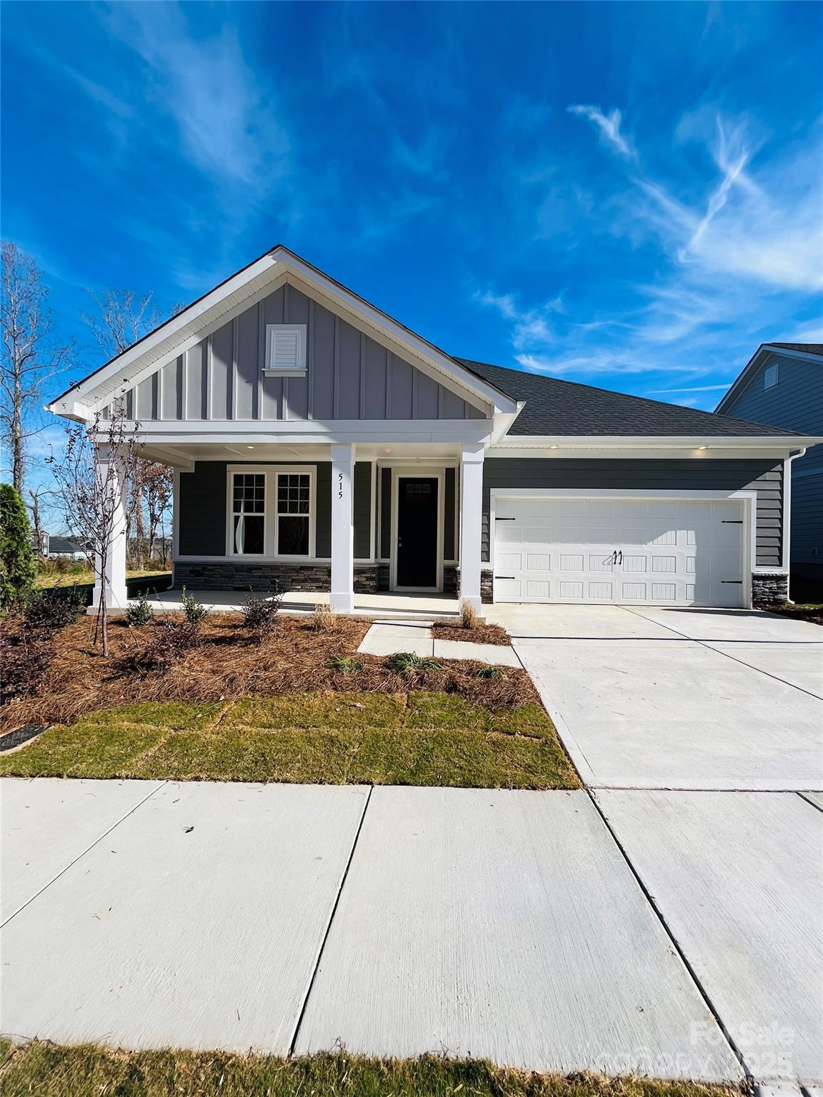 515 Tates Trail, Unit 39 Cramerton, NC 28056 - Photo 20 of 33 a front view of a house with a yard