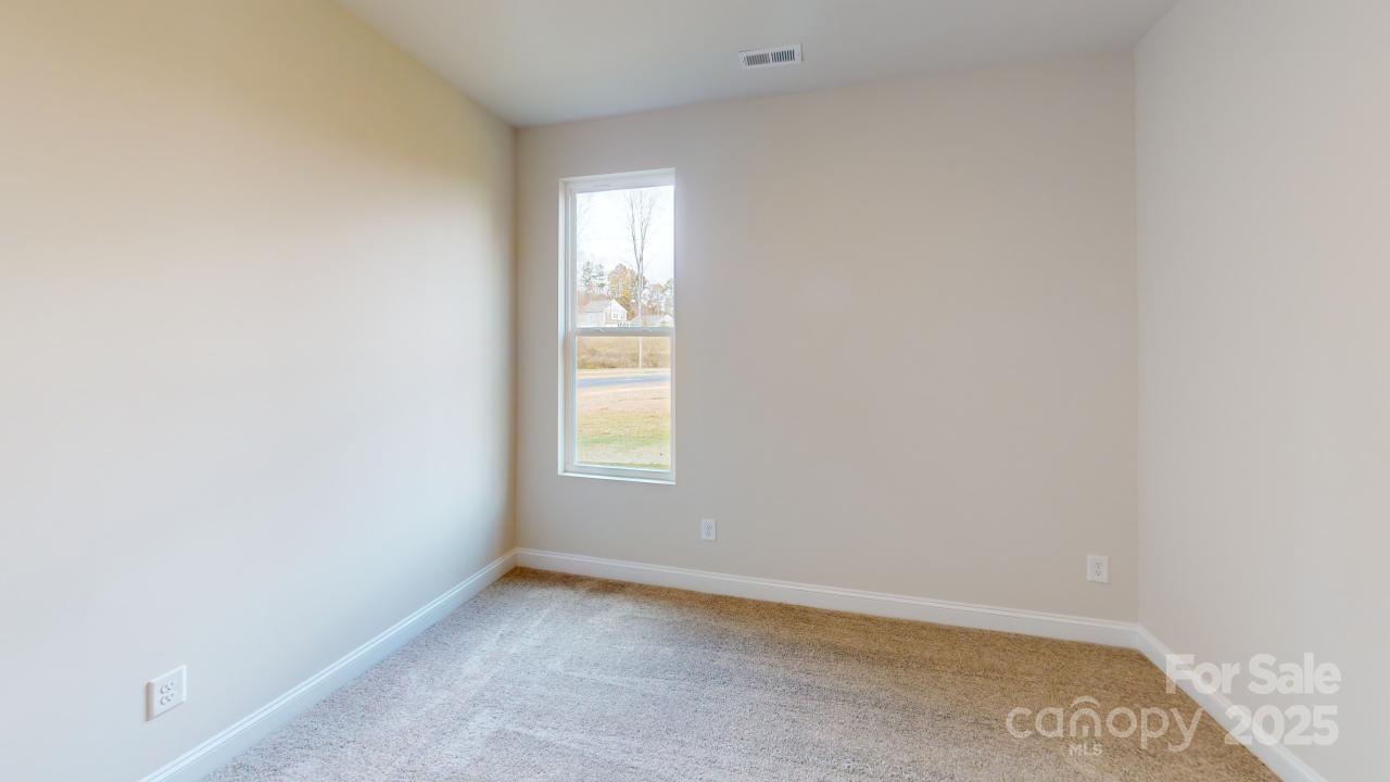 515 Tates Trail, Unit 39 Cramerton, NC 28056 - Photo 6 of 33 an empty room with a window
