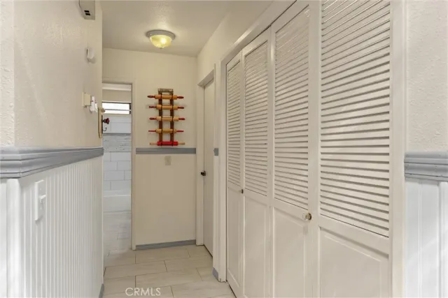 a bedroom with a bed and a potted plant
