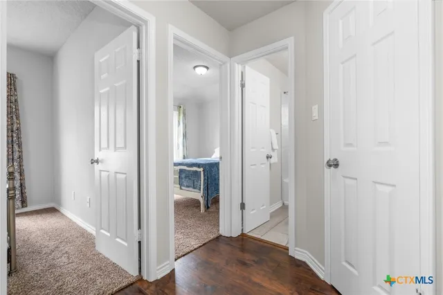 a view of a bathroom with wooden floor