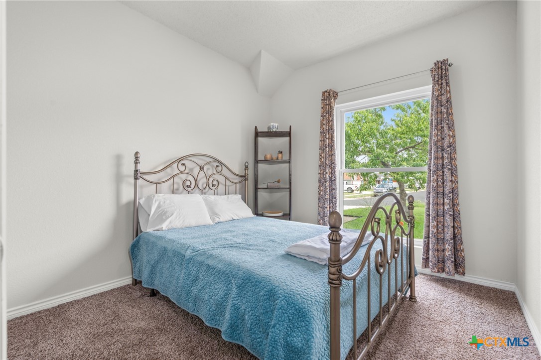 2804 Bluejay Drive Killeen, TX 76549 - Photo 22 of 36 a bedroom with a bed a table and a window