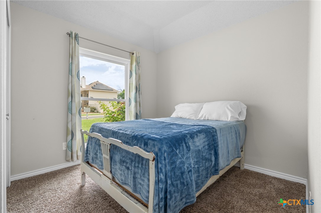 2804 Bluejay Drive Killeen, TX 76549 - Photo 24 of 36 a bed sitting in a bedroom next to a window