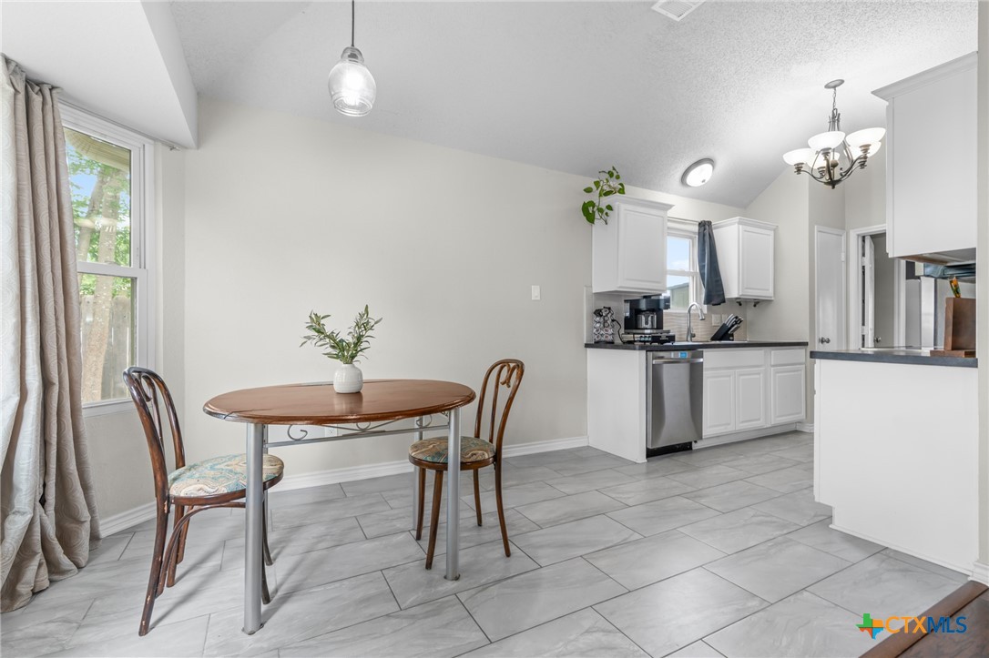 2804 Bluejay Drive Killeen, TX 76549 - Photo 9 of 36 a view of a dining room with furniture and chandelier