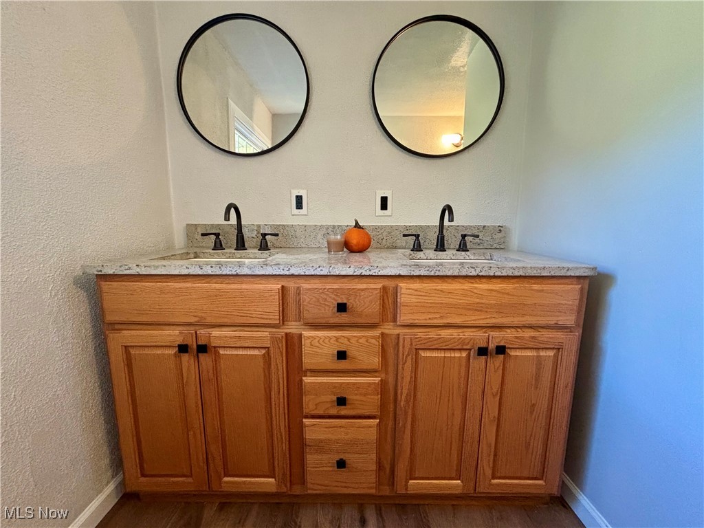 3522 Tent Church Road Colliers, WV 26035 - Photo 10 of 27 Bathroom with a textured wall, double vanity, and dark wood-style floors