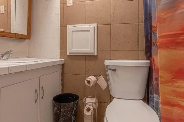 a bathroom with a toilet and a sink