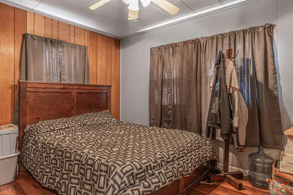 a bedroom with a bed and a dresser