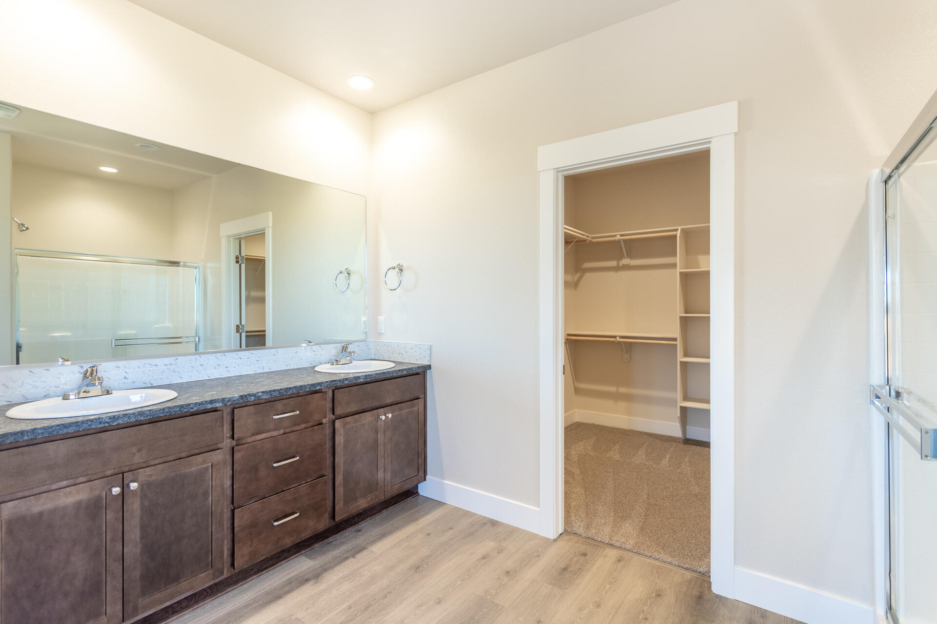 3063 Karuk Avenue Redding, CA 96002 - Photo 12 of 30 a spacious bathroom with a double vanity sink and a mirror