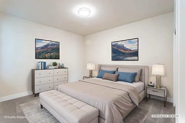 a bedroom with a bed and a dresser