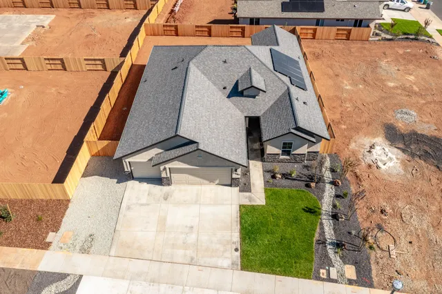 an aerial view of a house with swimming pool