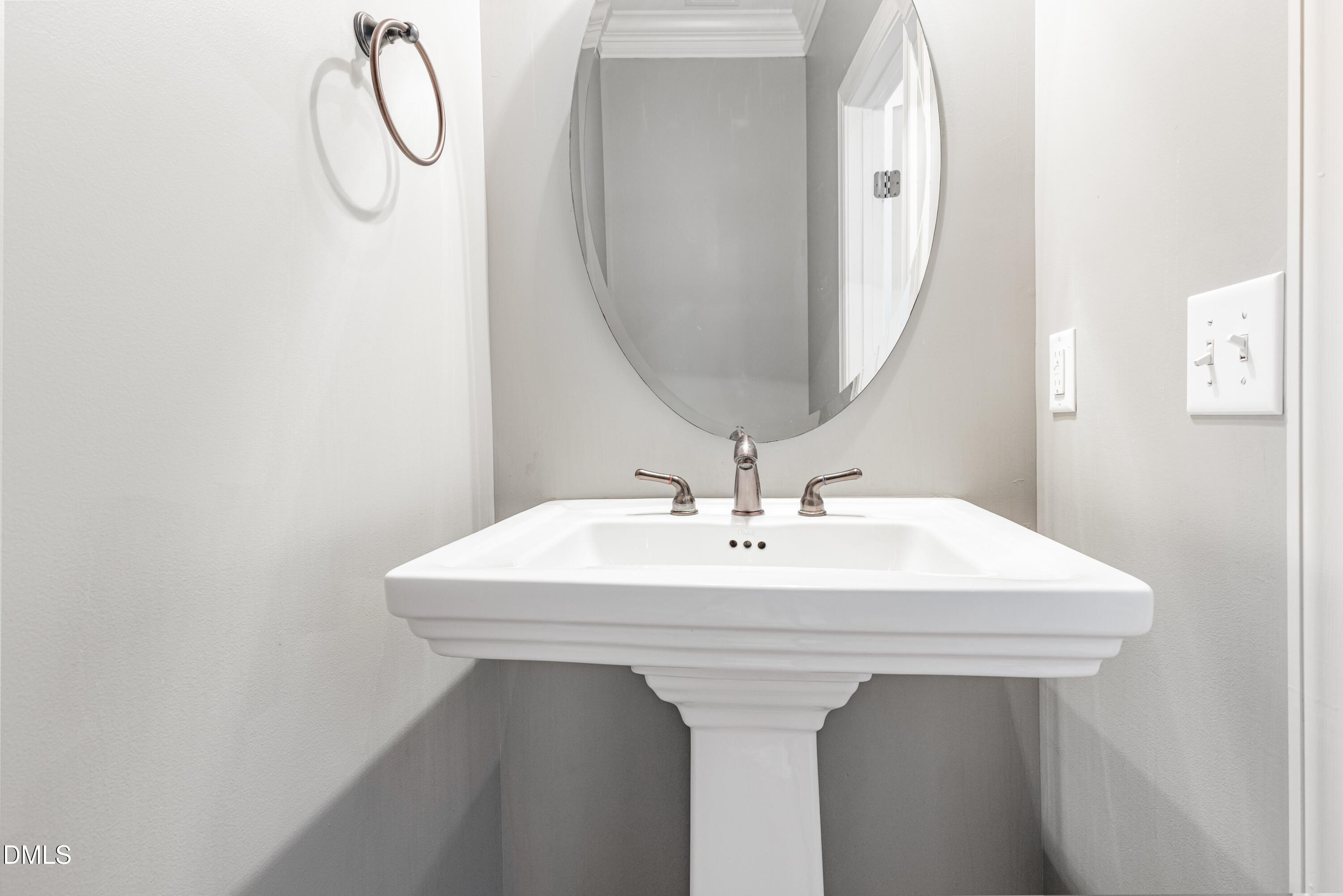 204 Blair Hills Road Wendell, NC 27591 - Photo 10 of 24 a white sink sitting under a bathroom mirror