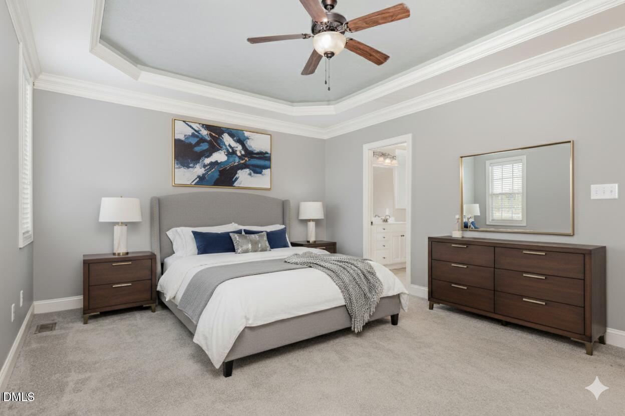 204 Blair Hills Road Wendell, NC 27591 - Photo 13 of 24 a bed room with a bed and a mirror