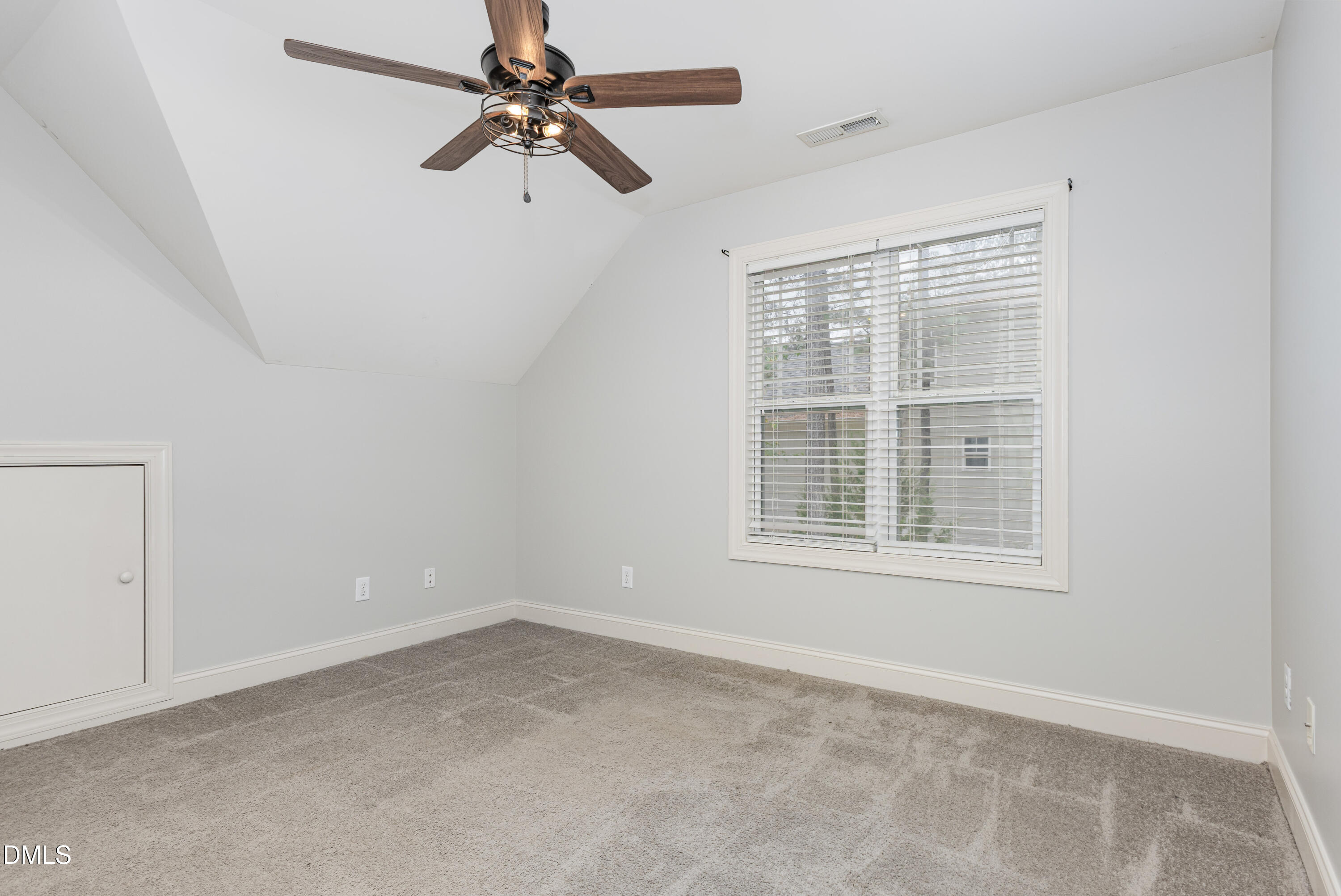 204 Blair Hills Road Wendell, NC 27591 - Photo 16 of 24 an empty room with a window and a fan