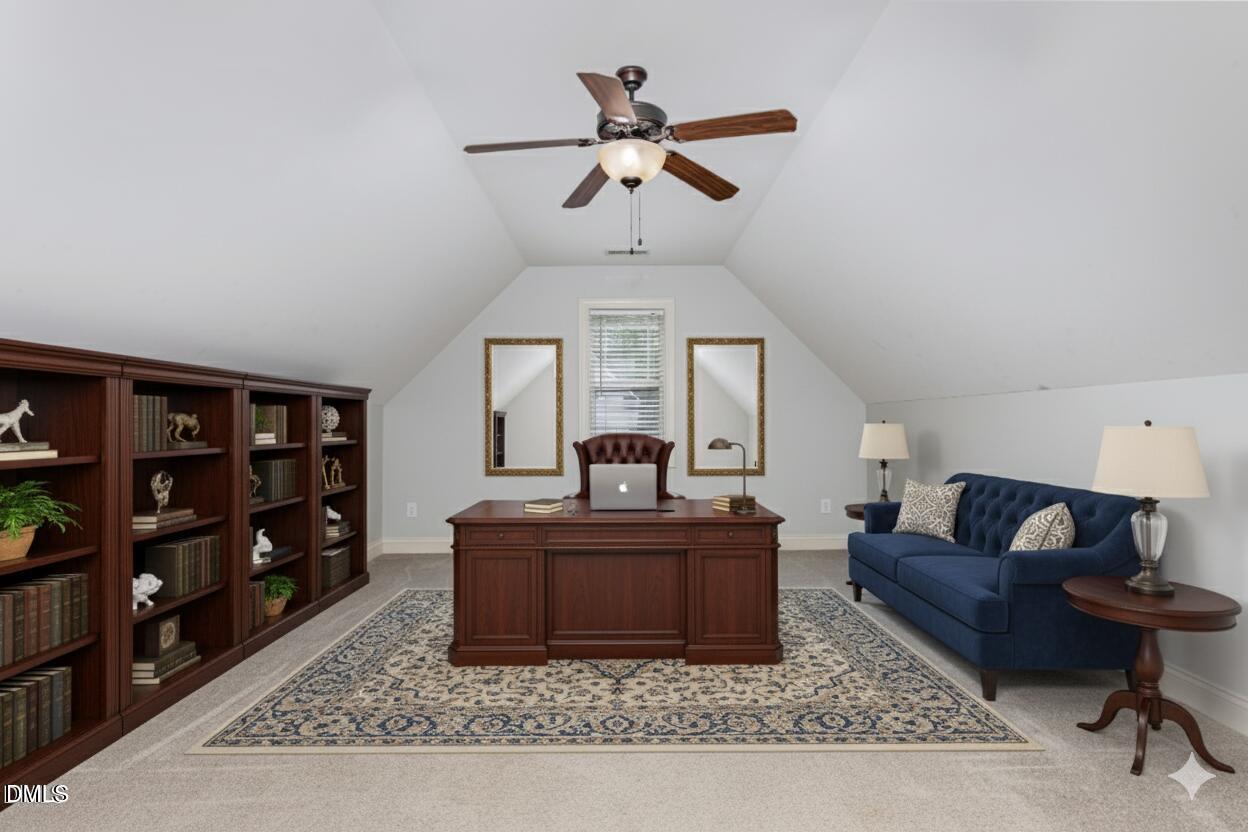 204 Blair Hills Road Wendell, NC 27591 - Photo 20 of 24 a living room with furniture a rug and a chandelier