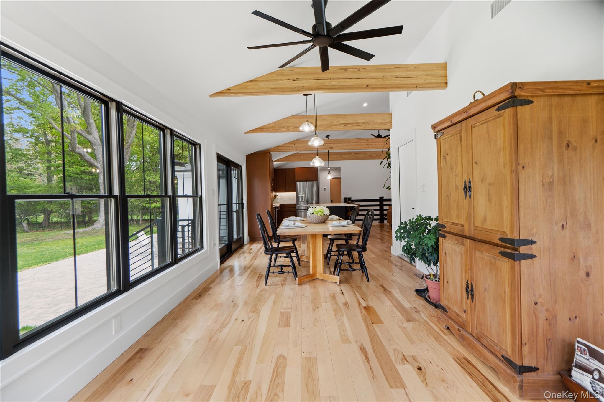 263 Beaver Dam Road Brookhaven, NY 11719 - Photo 15 of 32 a dining room with wooden floor and windows