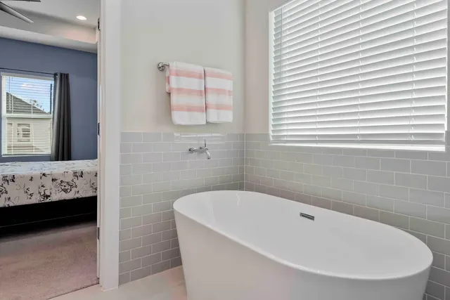 a bathroom with a bathtub and a sink