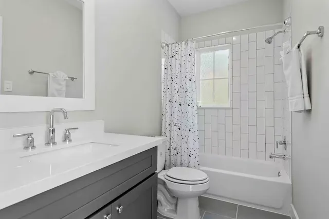 a bathroom with a sink a toilet and a bathtub