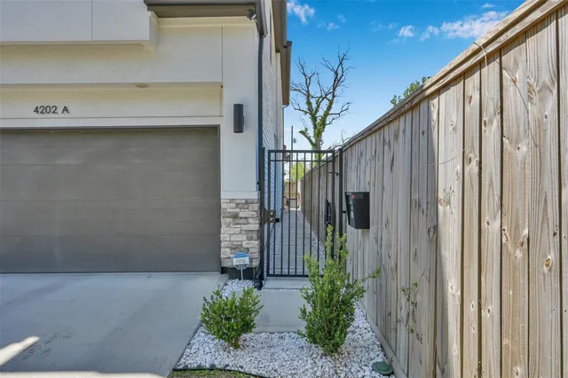 a front view of a house with a plant