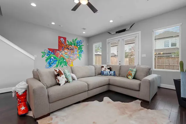 a living room with furniture and a window