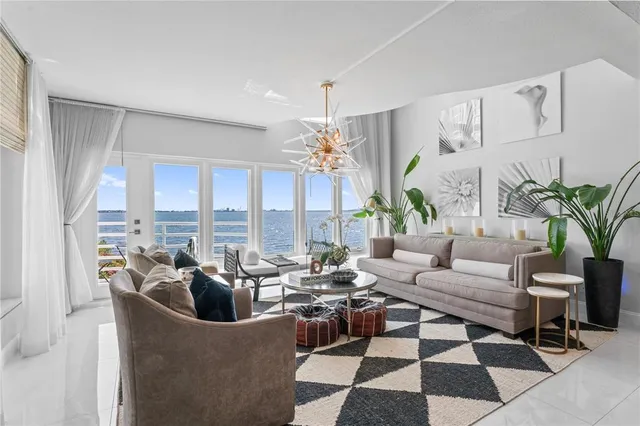 a view of a livingroom with workspace and a window