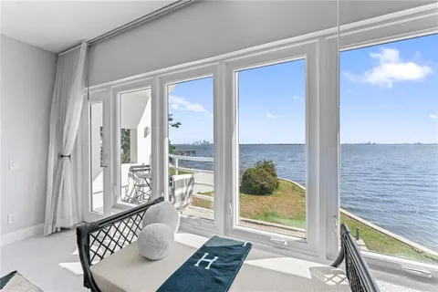 a dining room with furniture a window and wooden floor