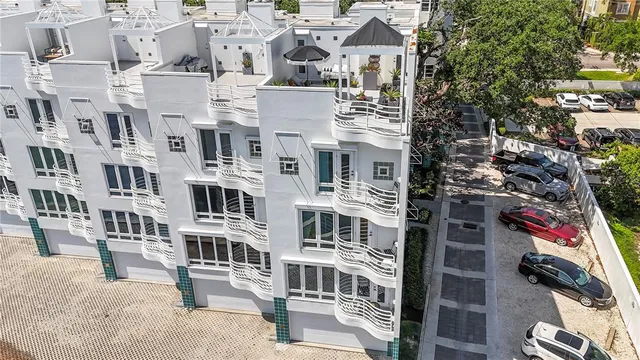a backyard of a house with lots of green space and a fountain