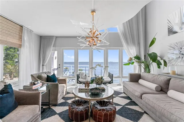 a kitchen with stainless steel appliances granite countertop a sink a stove and cabinets