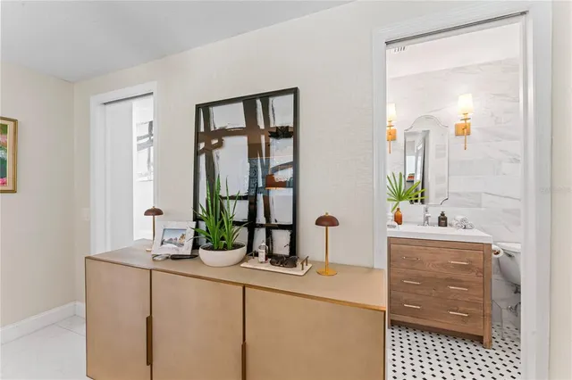 a bedroom with a large bed and a television