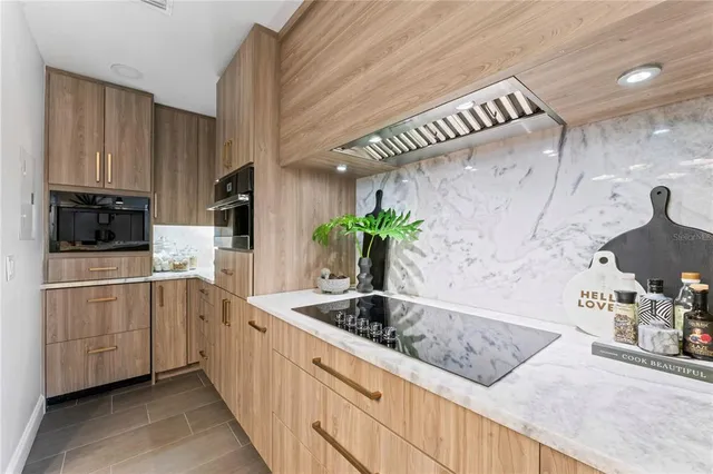 a view of a street with potted plants and large trees