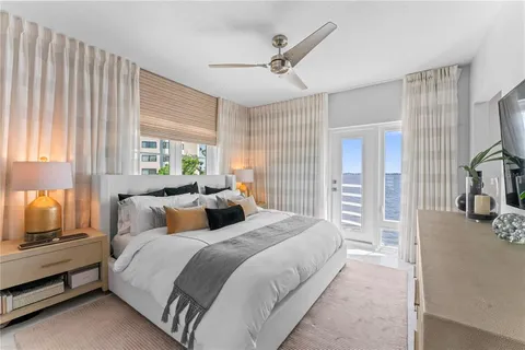 a potted plant sitting on a floor in front of a house