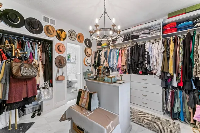 an aerial view of a house with a yard and potted plants